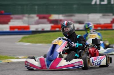 Football player karting on course